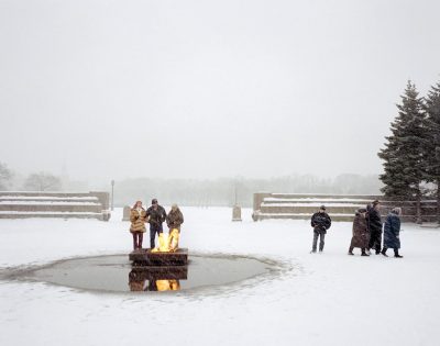 Friends keep warm by the eternal flame, St Petersburg, Northwestern Region, December 2004
