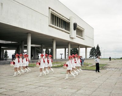A marching school band pass under Lenin, Ulyanovsk, Volga, June 2005